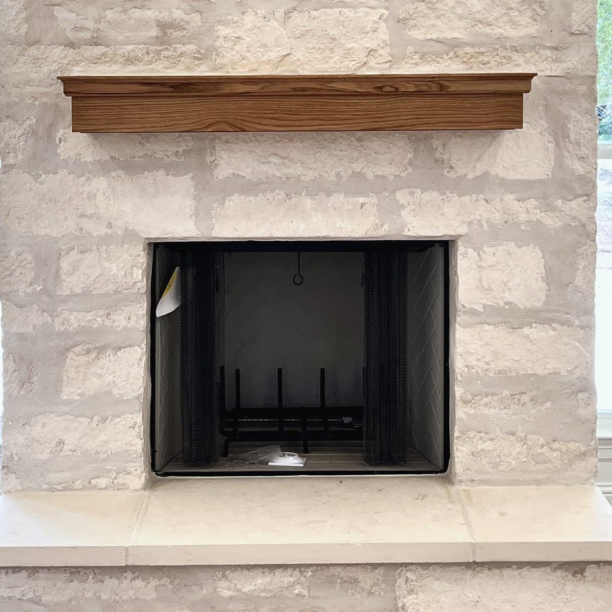Cedar mantel over a firebox