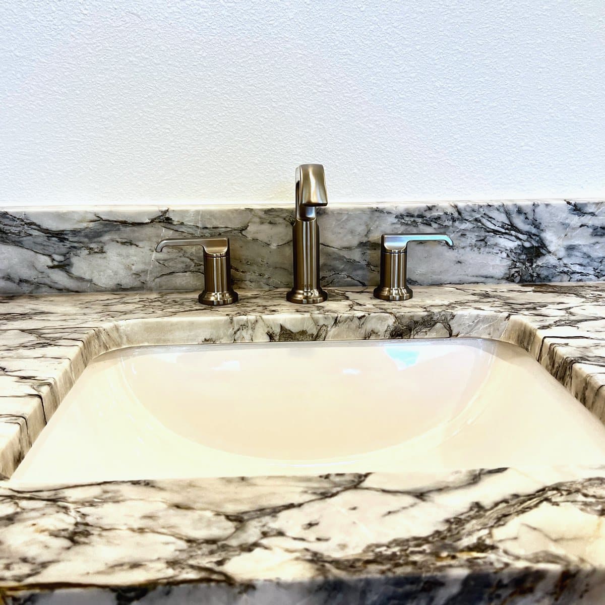 Heavily veined marble vanity