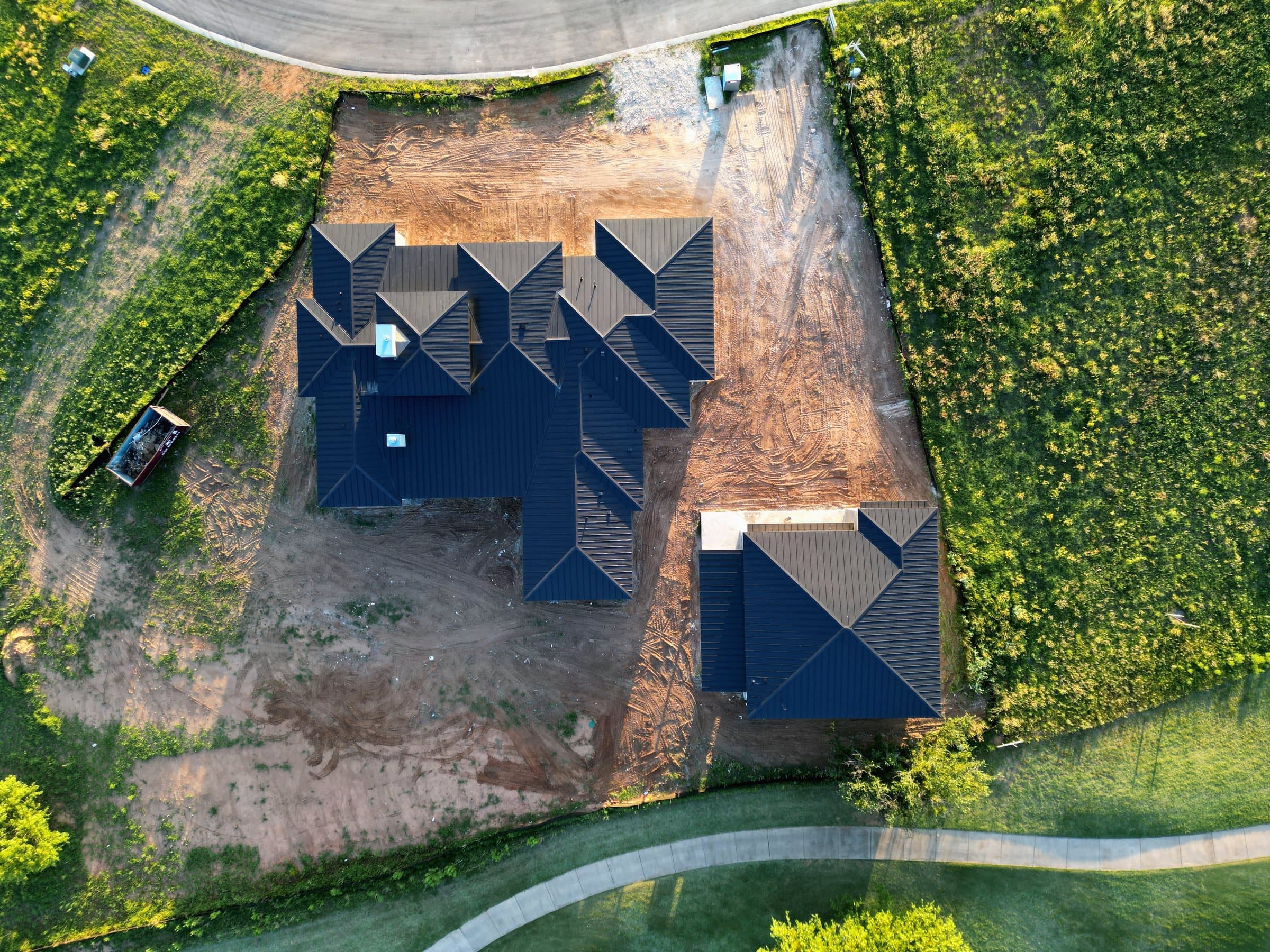 Aerial view of a metal roof going on during construction